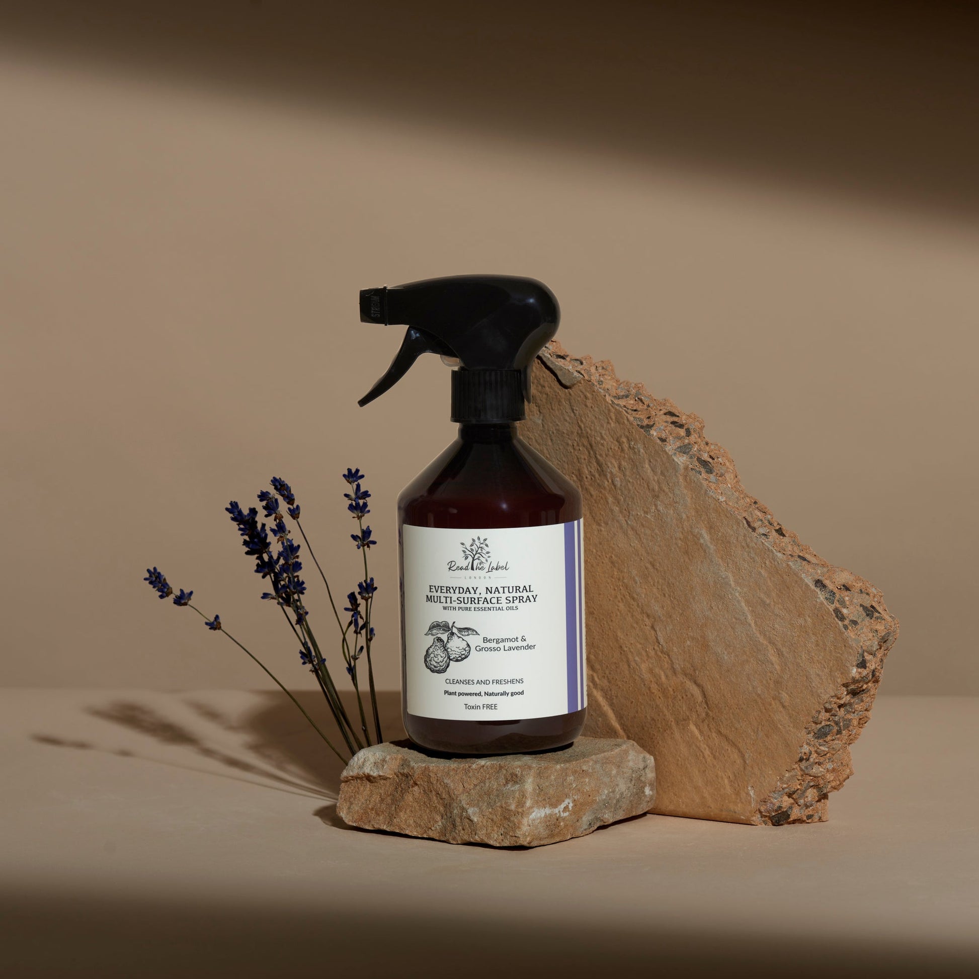 Natural multi-surface cleaner from Read The Label London with bergamot and grosso lavender, showing spray bottle and fresh ingredients.