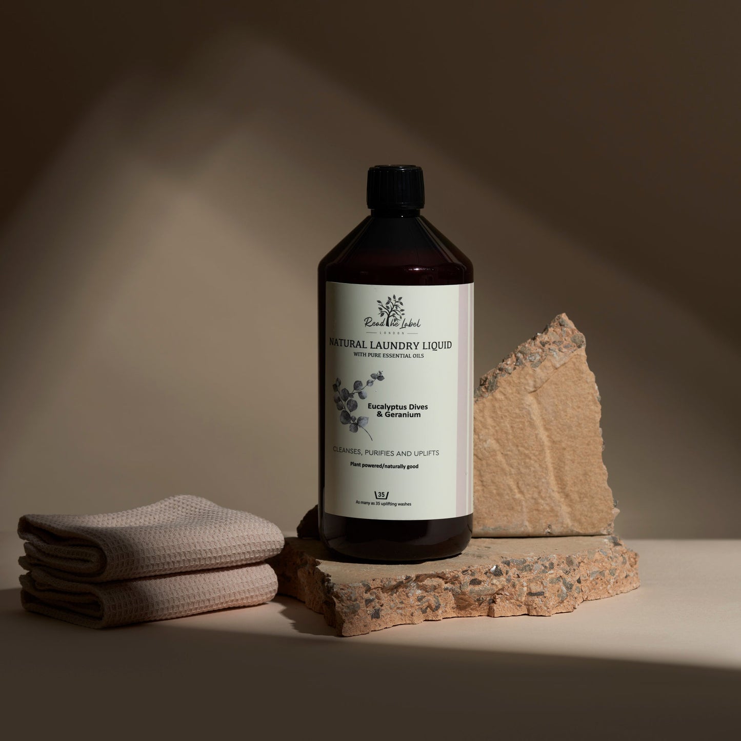 Natural laundry liquid with eucalyptus and geranium by Read The Label London, showing a clear bottle with fresh floral scent.